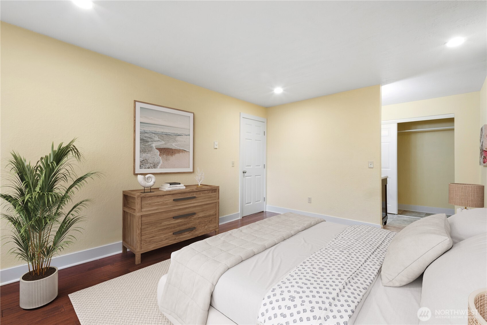 14401 Southeast Petrovitsky Road, Unit B209 Renton, WA 98058 - Photo 28 of 35 a bedroom with a bed and a potted plant