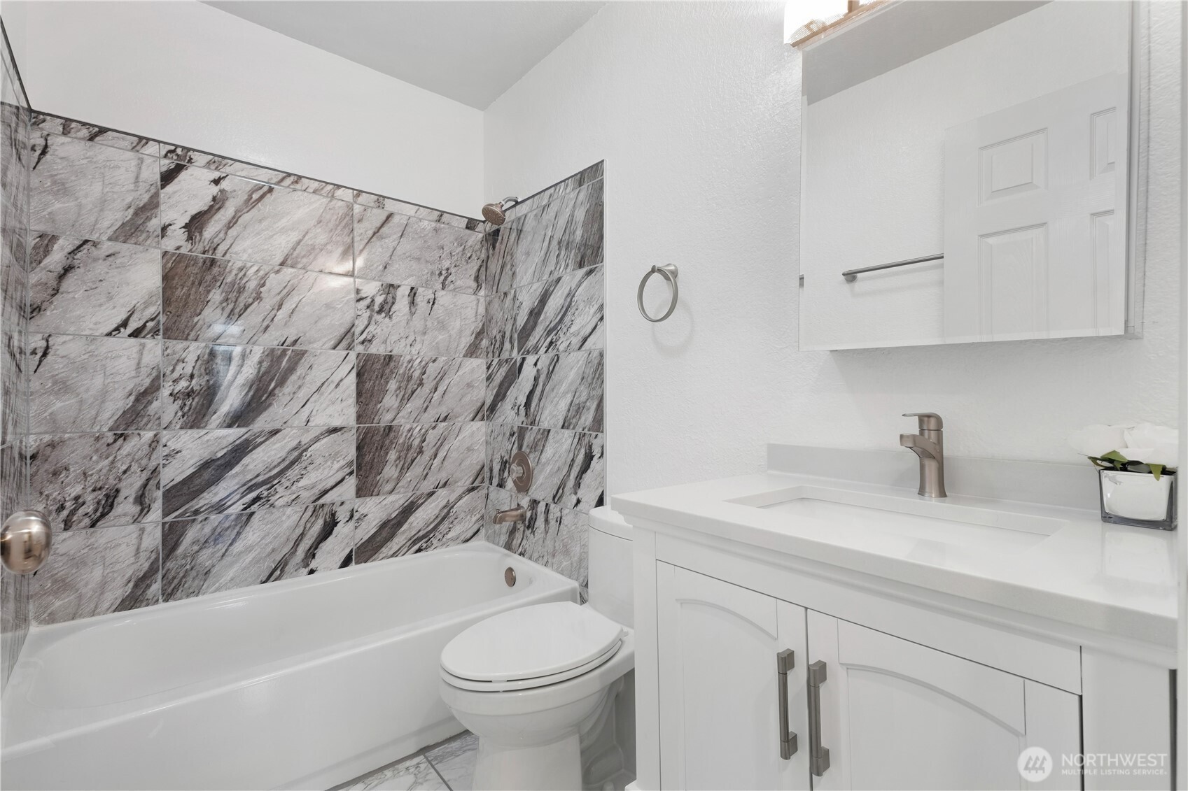 14401 Southeast Petrovitsky Road, Unit B209 Renton, WA 98058 - Photo 29 of 35 a bathroom with a sink toilet and shower