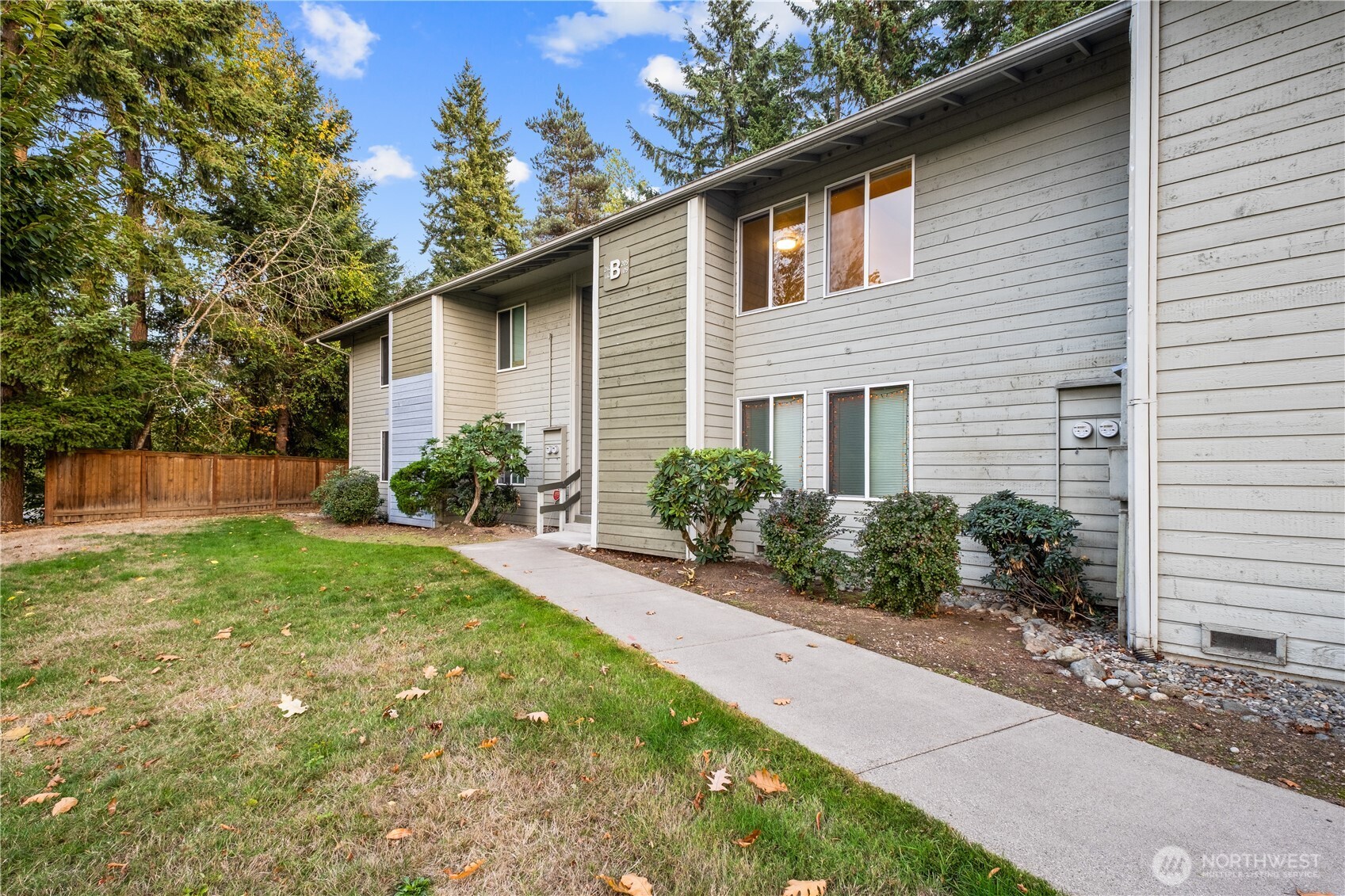 14401 Southeast Petrovitsky Road, Unit B209 Renton, WA 98058 - Photo 33 of 35 a front view of house with yard and green space
