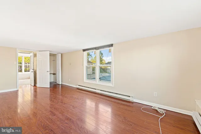 a view of an empty room with a large window