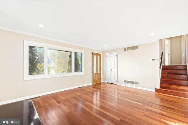 a kitchen with a refrigerator sink and cabinets