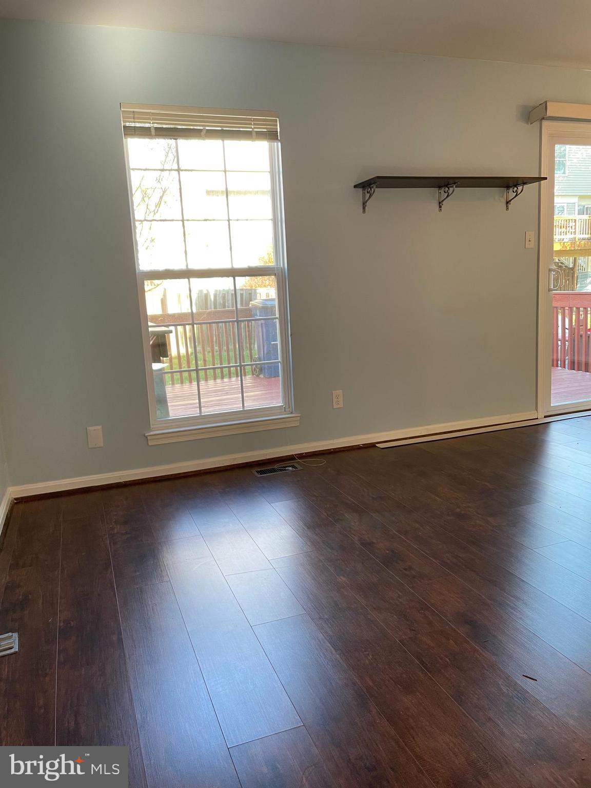 12405 Gooderham Way Gaithersburg, MD 20878 - Photo 14 of 31 an empty room with wooden floor and windows