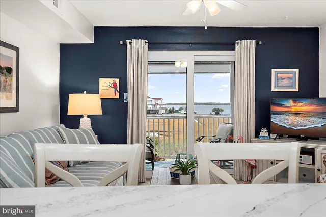 a living room with furniture and a lamp