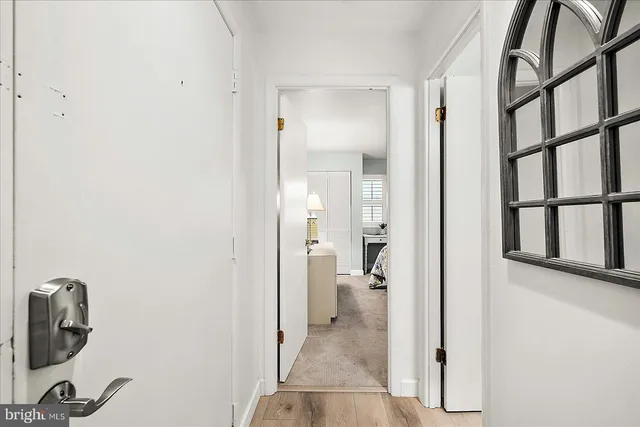 a bathroom with a glass door shower and a sink