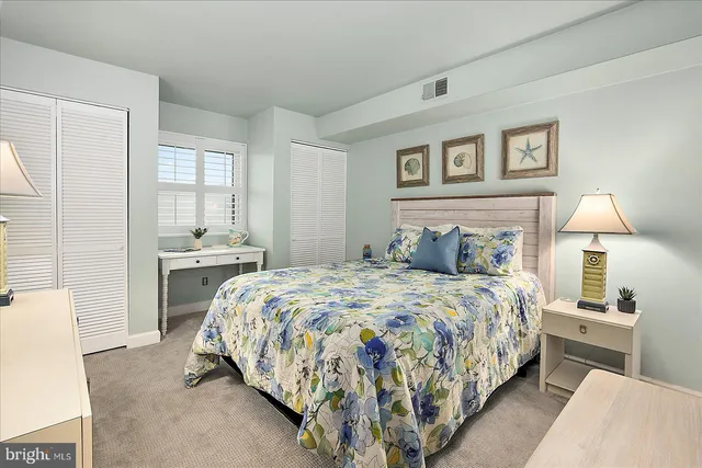 a bedroom with bed and a window