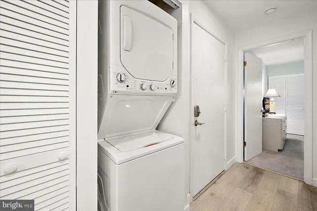 a view of washer and dryer with bathroom