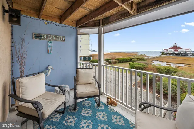 a view of two chairs in the balcony