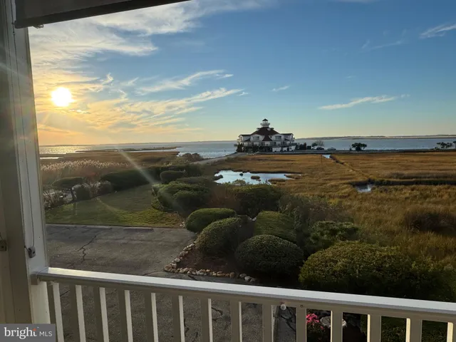 a view of a balcony with an ocean view