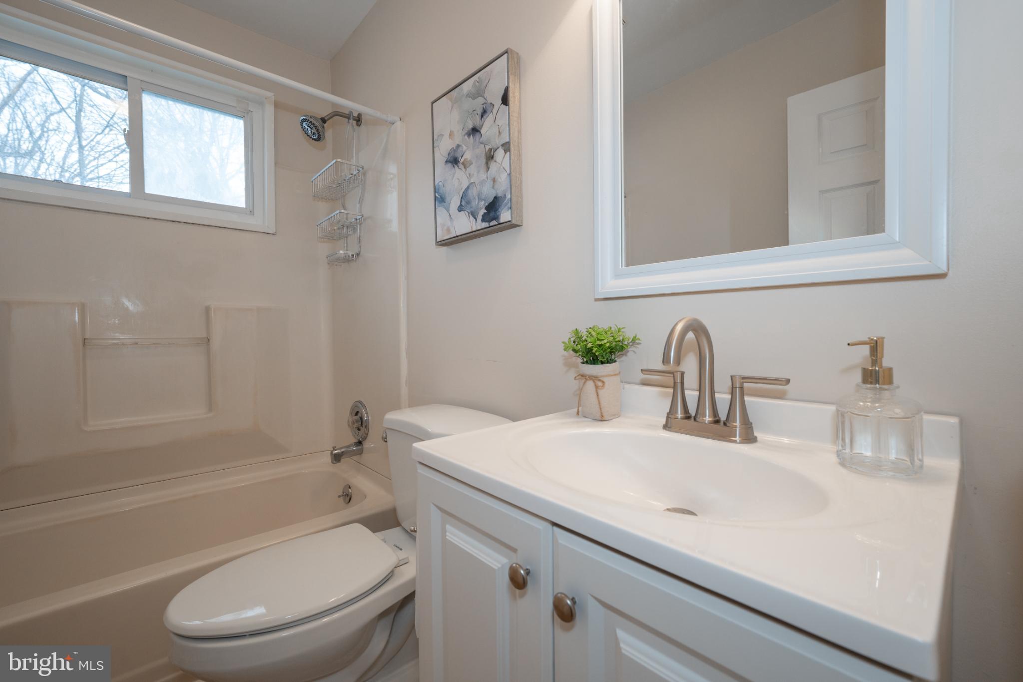3999 Riviera Drive Upper Chichester, PA 19061 - Photo 18 of 32 Bathroom with tub shower with fresh paint and LVP.