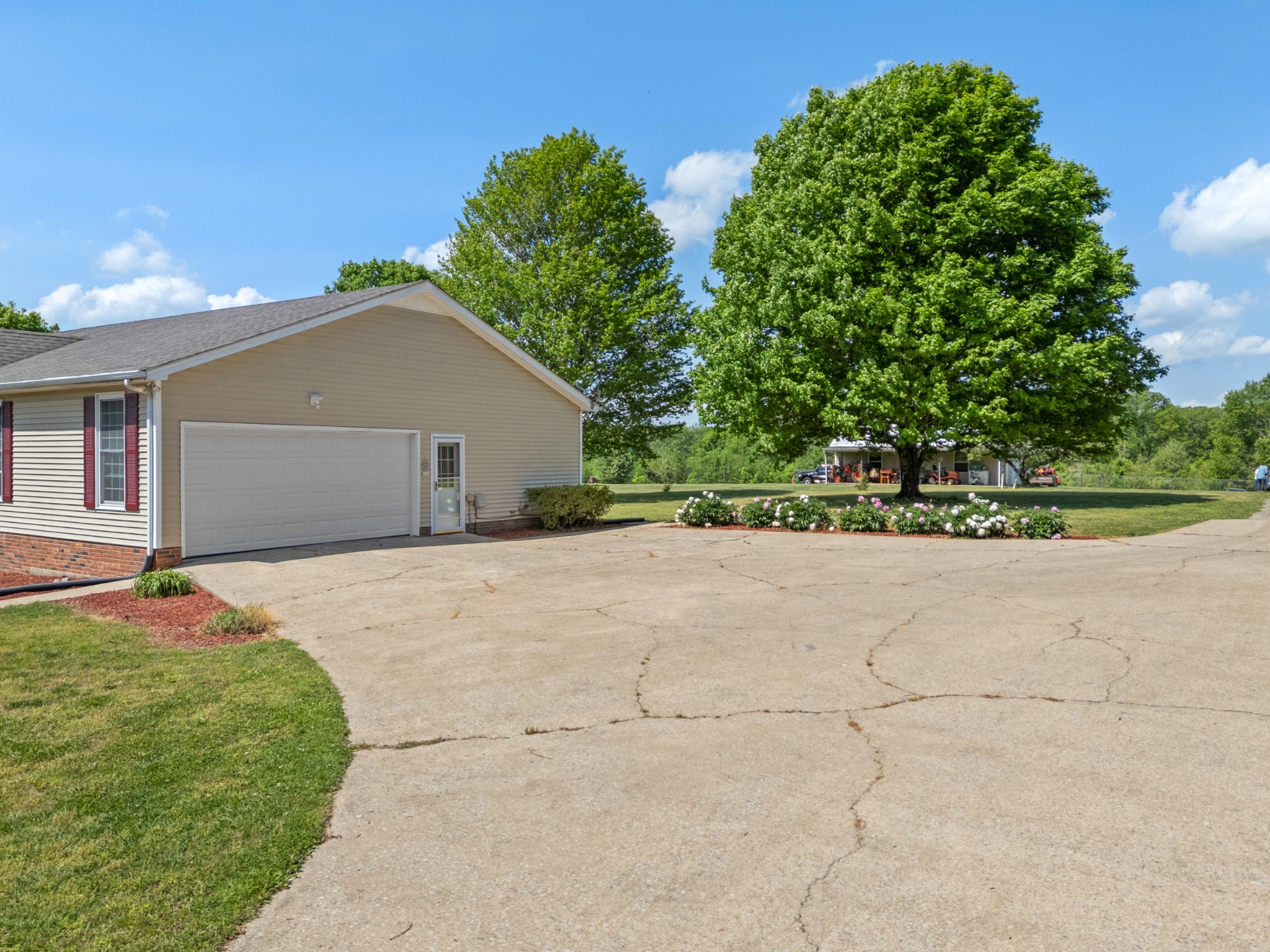 1010 State Highway 48 Dickson, TN 37055 - Photo 21 of 59 a front view of a house with a yard and a garage