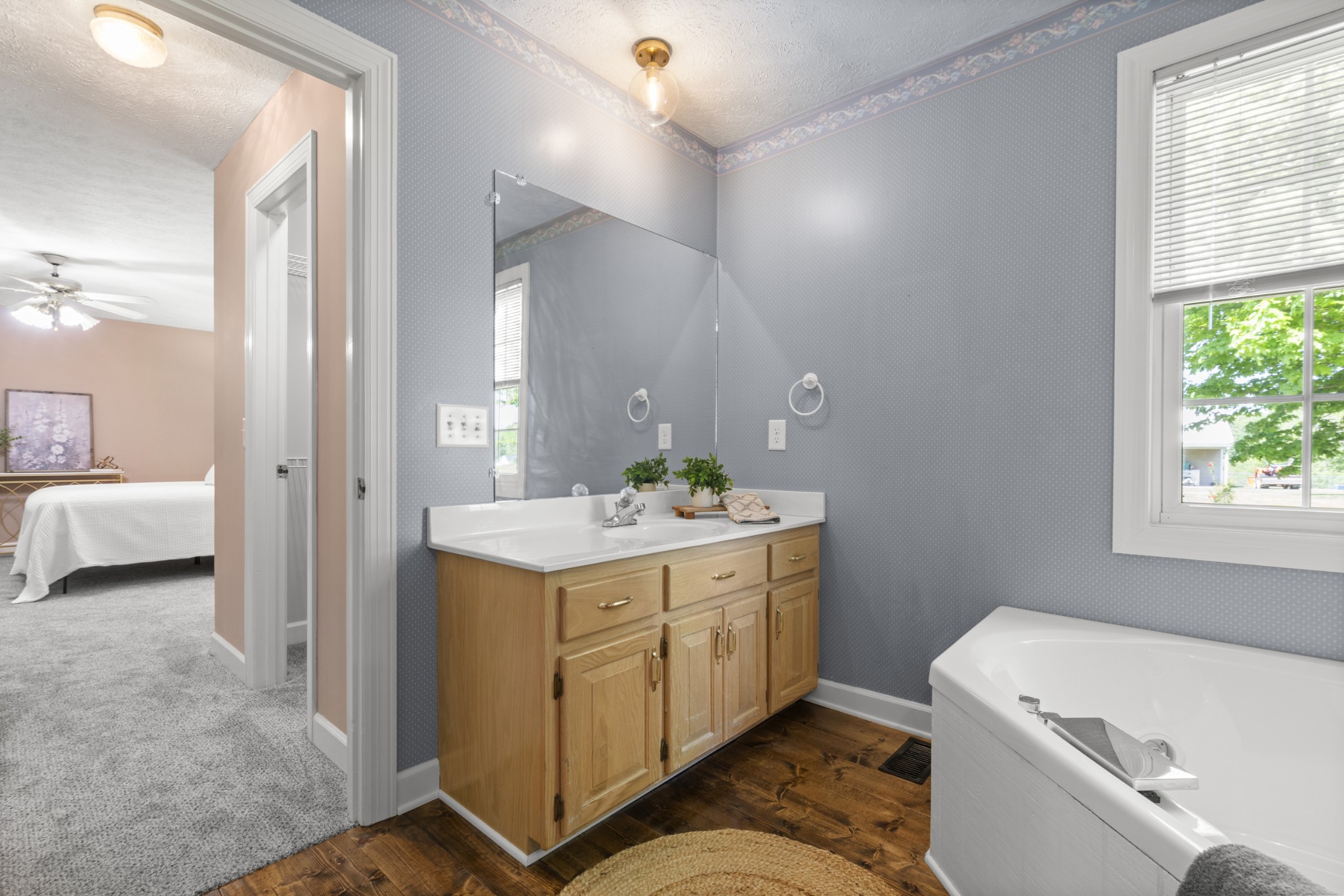 1010 State Highway 48 Dickson, TN 37055 - Photo 27 of 59 a bathroom with a sink a toilet and a mirror