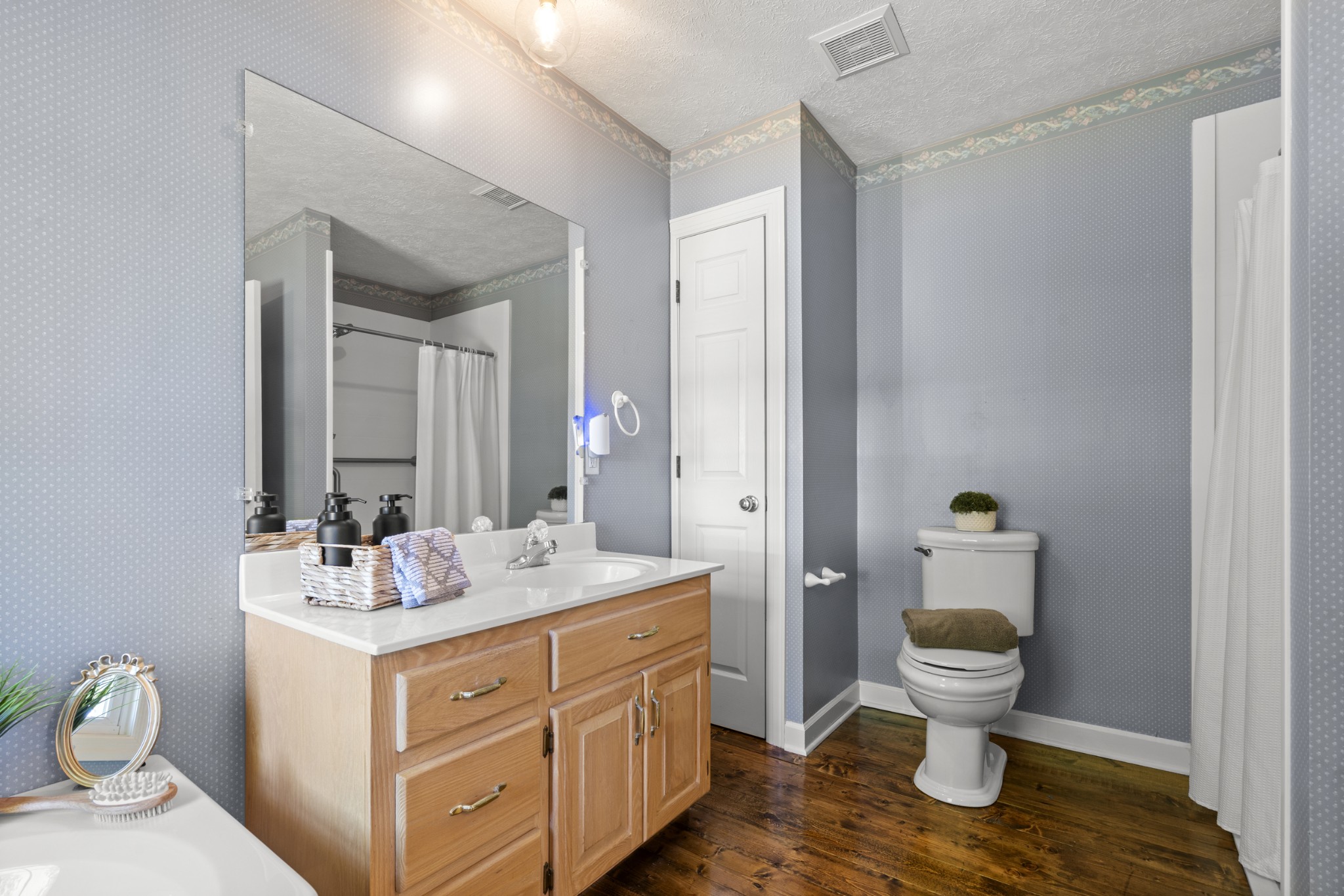 1010 State Highway 48 Dickson, TN 37055 - Photo 28 of 59 a bathroom with a toilet sink and mirror