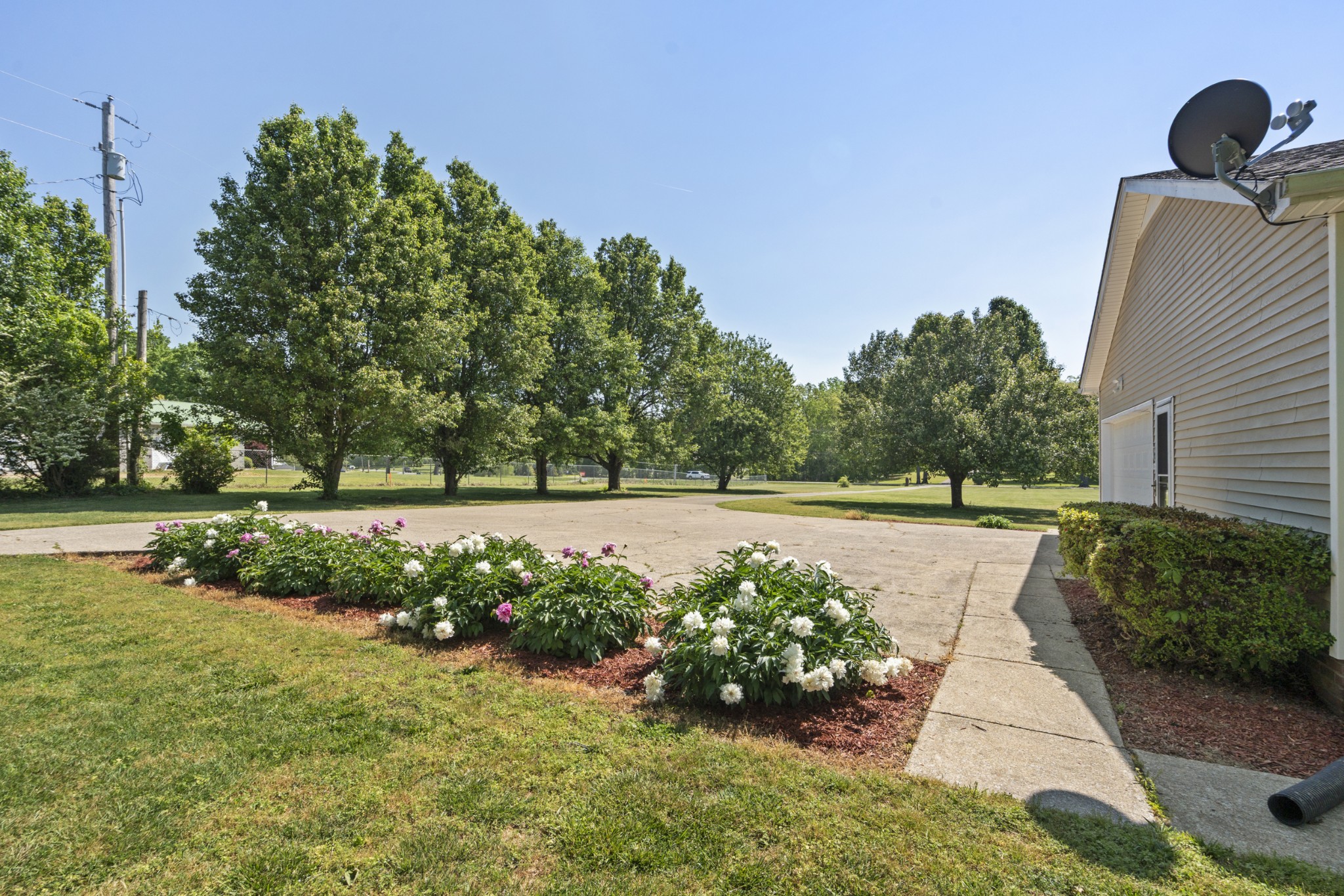 1010 State Highway 48 Dickson, TN 37055 - Photo 37 of 59 a view of a garden with flowers and trees