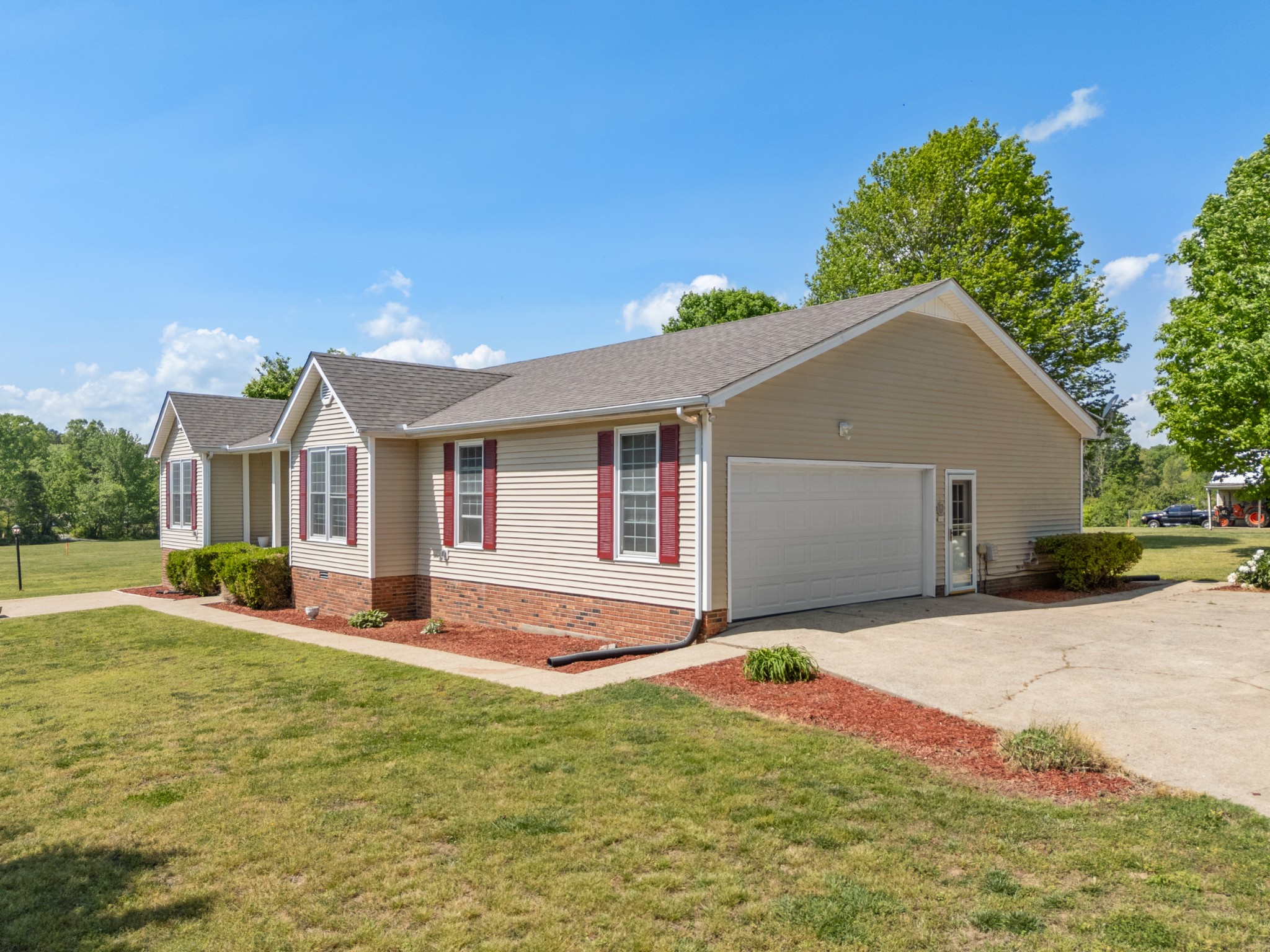 1010 State Highway 48 Dickson, TN 37055 - Photo 4 of 59 a front view of house with yard and trees in the background