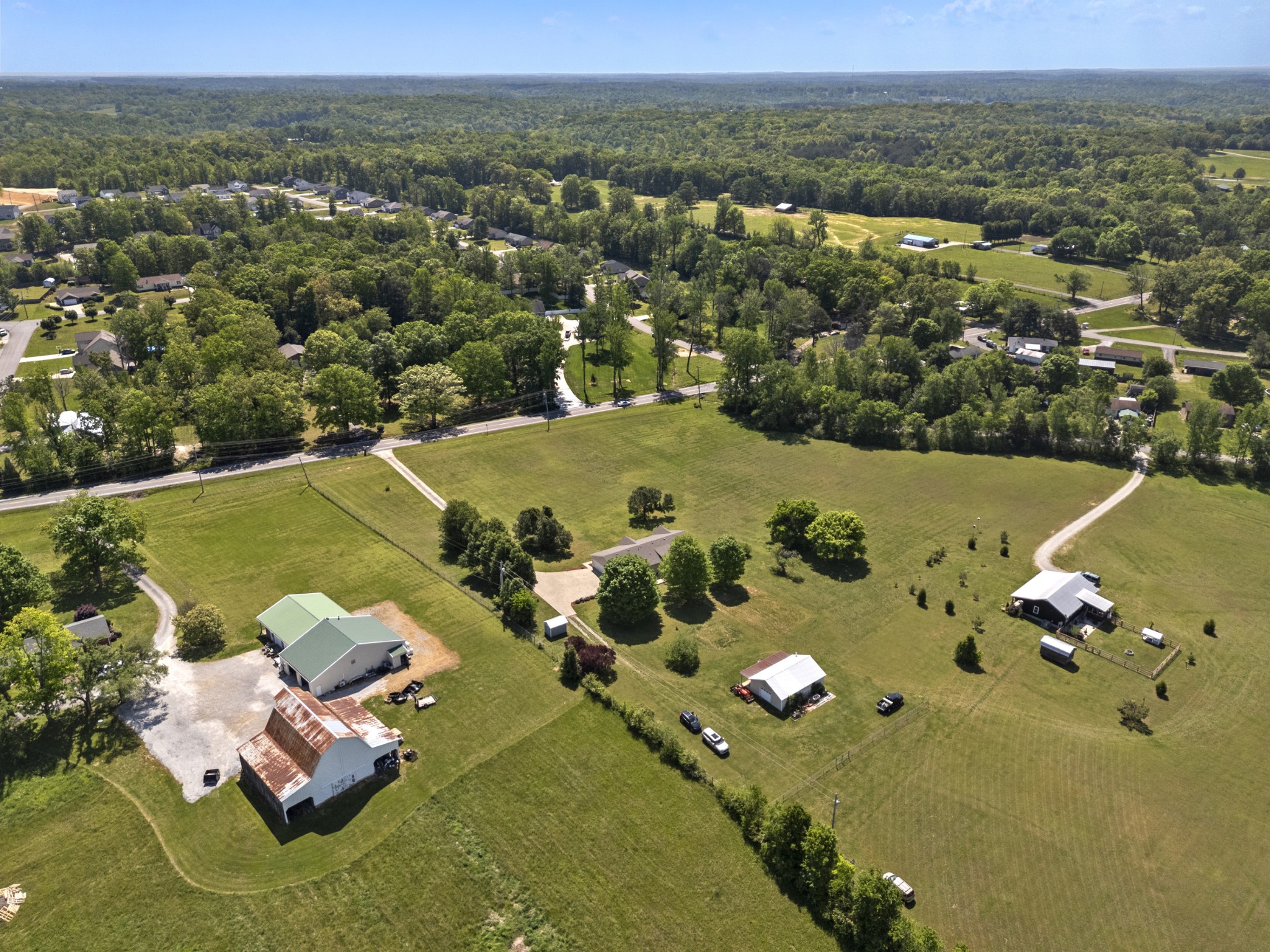 1010 State Highway 48 Dickson, TN 37055 - Photo 51 of 59 an aerial view of a house with a swimming pool