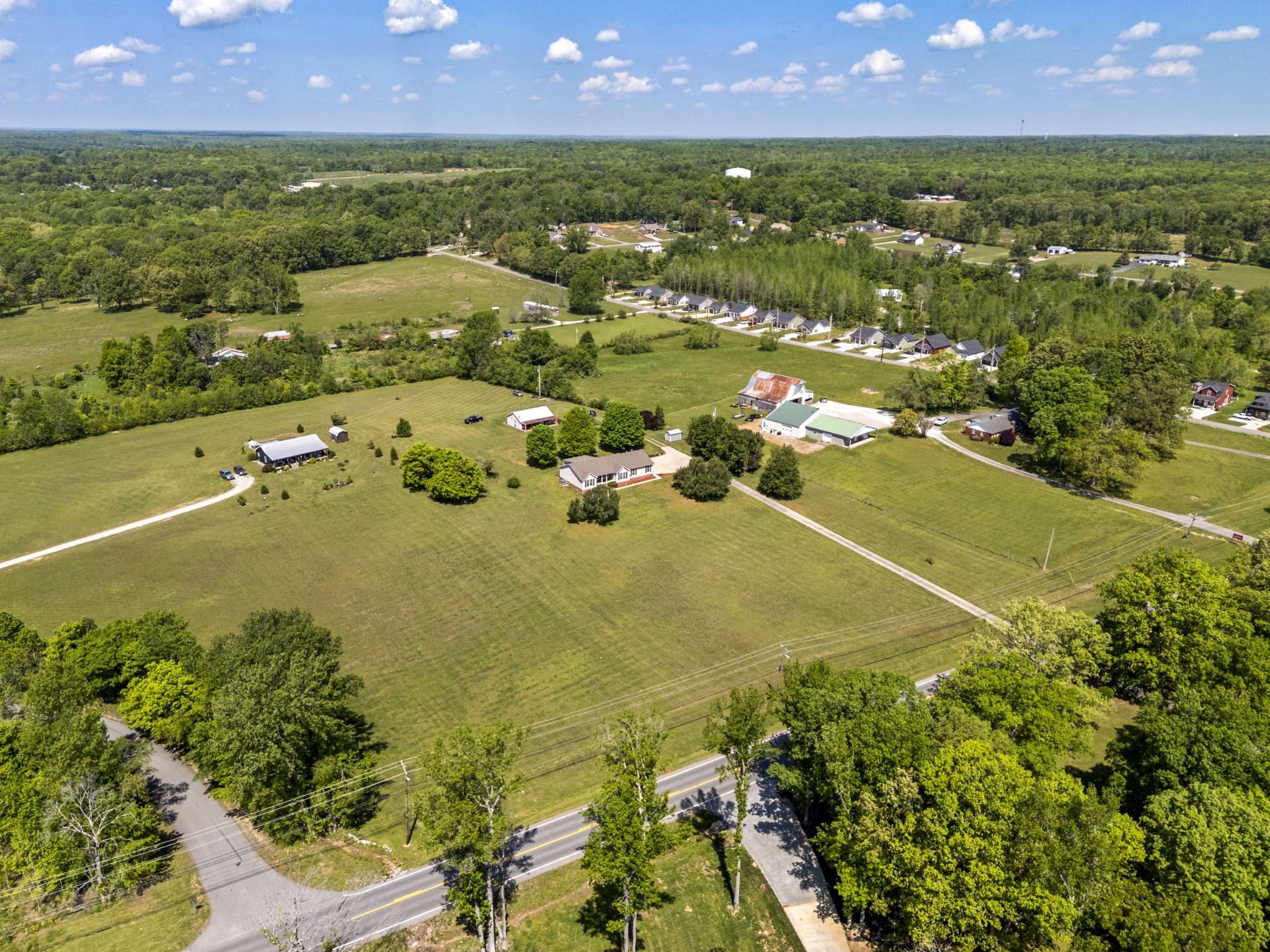 1010 State Highway 48 Dickson, TN 37055 - Photo 54 of 59 an aerial view of residential houses with outdoor space and trees
