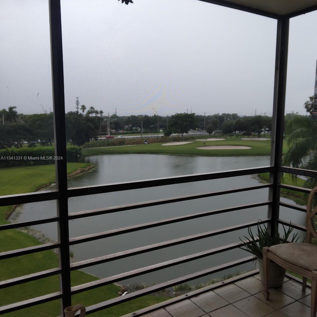 a view of a lake from a balcony with outdoor space