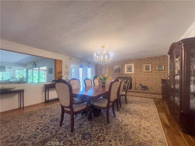 a dining room with furniture and chandelier