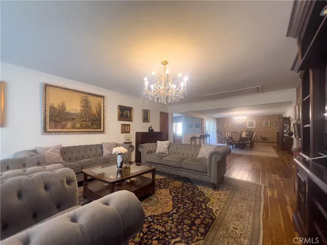 a bedroom with a bed and a mirror on dresser