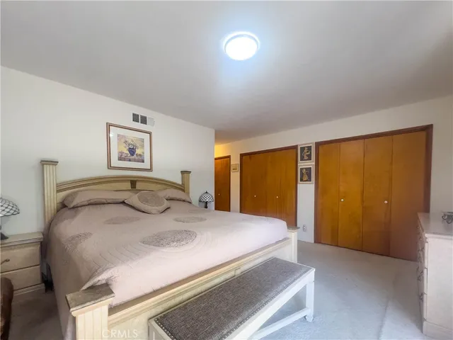 a bathroom with a double vanity sink a mirror and a shower