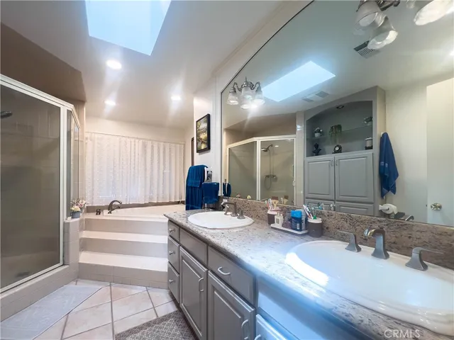 a bathroom with a tub and shower