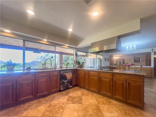 a kitchen with a sink and wooden cabinets