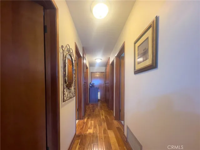 a view of a livingroom with furniture and a bookshelf