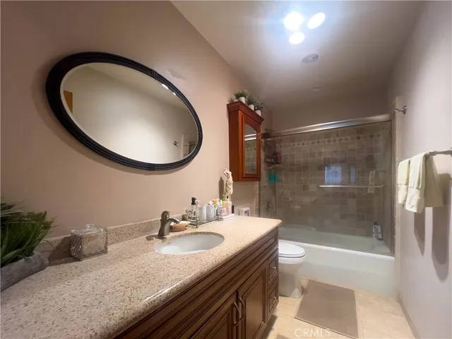 a bedroom with bed and window