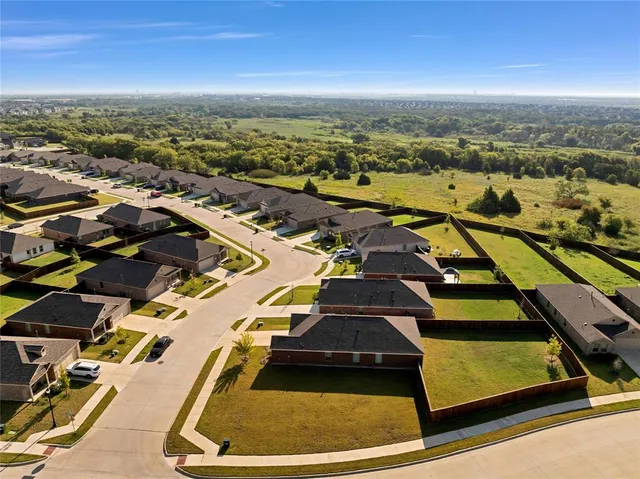 an aerial view of a tennis ground