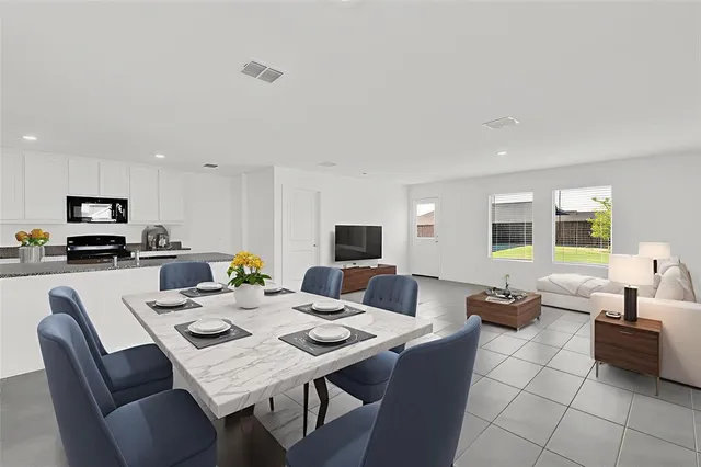 a view of a dining room with furniture