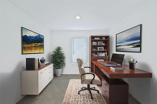 a workspace with furniture and window