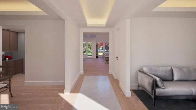 a hallway with furniture and wooden floor