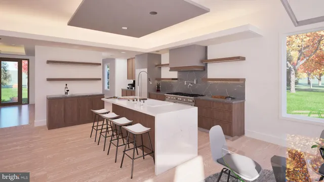 a kitchen with kitchen island a dining table chairs and a refrigerator