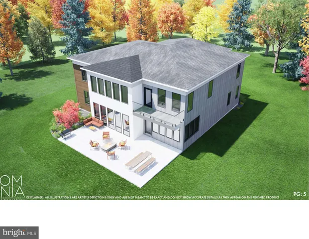 a aerial view of a house with a yard table and chairs