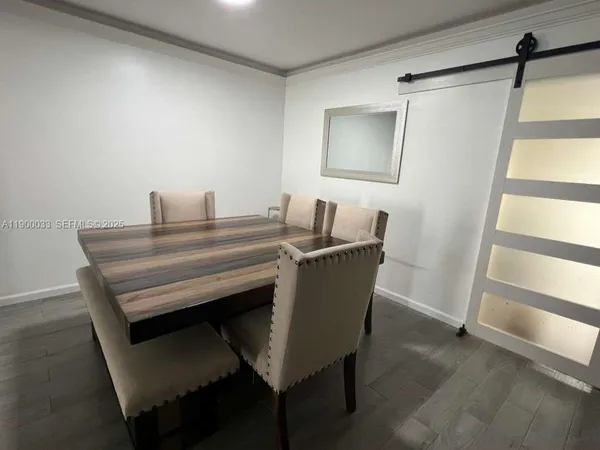 a bedroom with a bed and a night stand