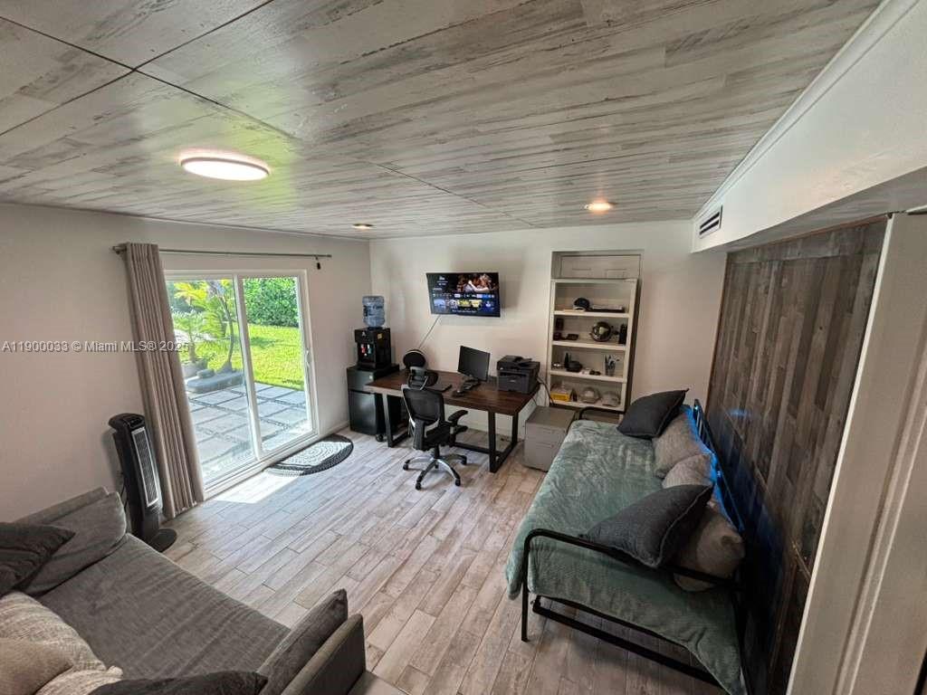 1430 Northeast 149th Street Miami, FL 33161 - Photo 33 of 51 a living room with furniture rug and a window