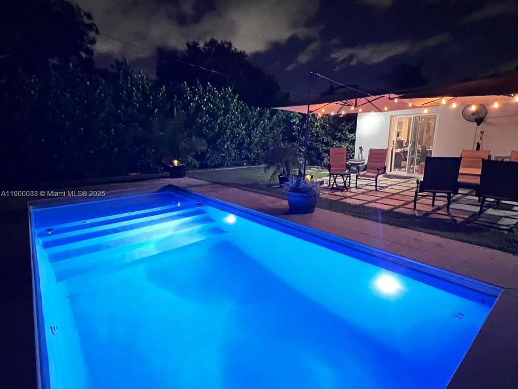 1430 Northeast 149th Street Miami, FL 33161 - Photo 41 of 51 a view of swimming pool with outdoor seating
