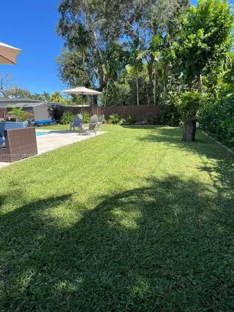 a view of a garden with patio