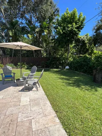 a view of swimming pool with seating space