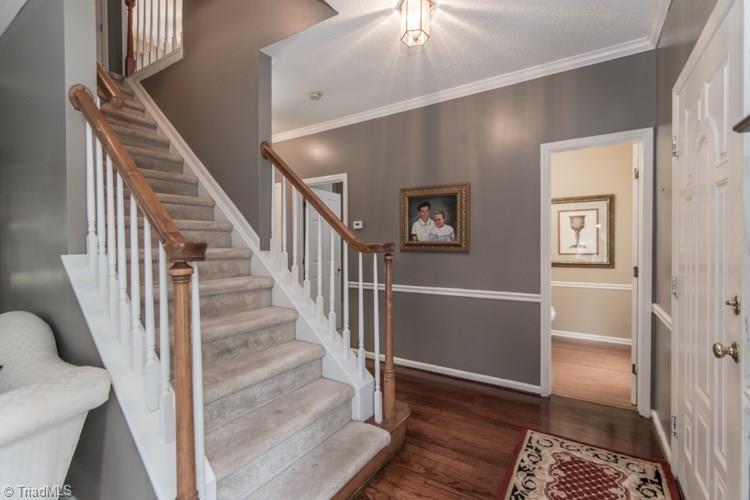 3325 Timberwolf Avenue High Point, NC 27265 - Photo 3 of 30 Entry way with access to half bath, hardwoods