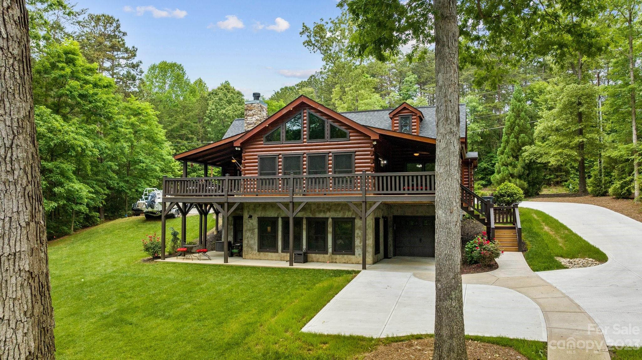 7478 Bankhead Road Denver, NC 28037 - Photo 1 of 48 a front view of a house with a yard