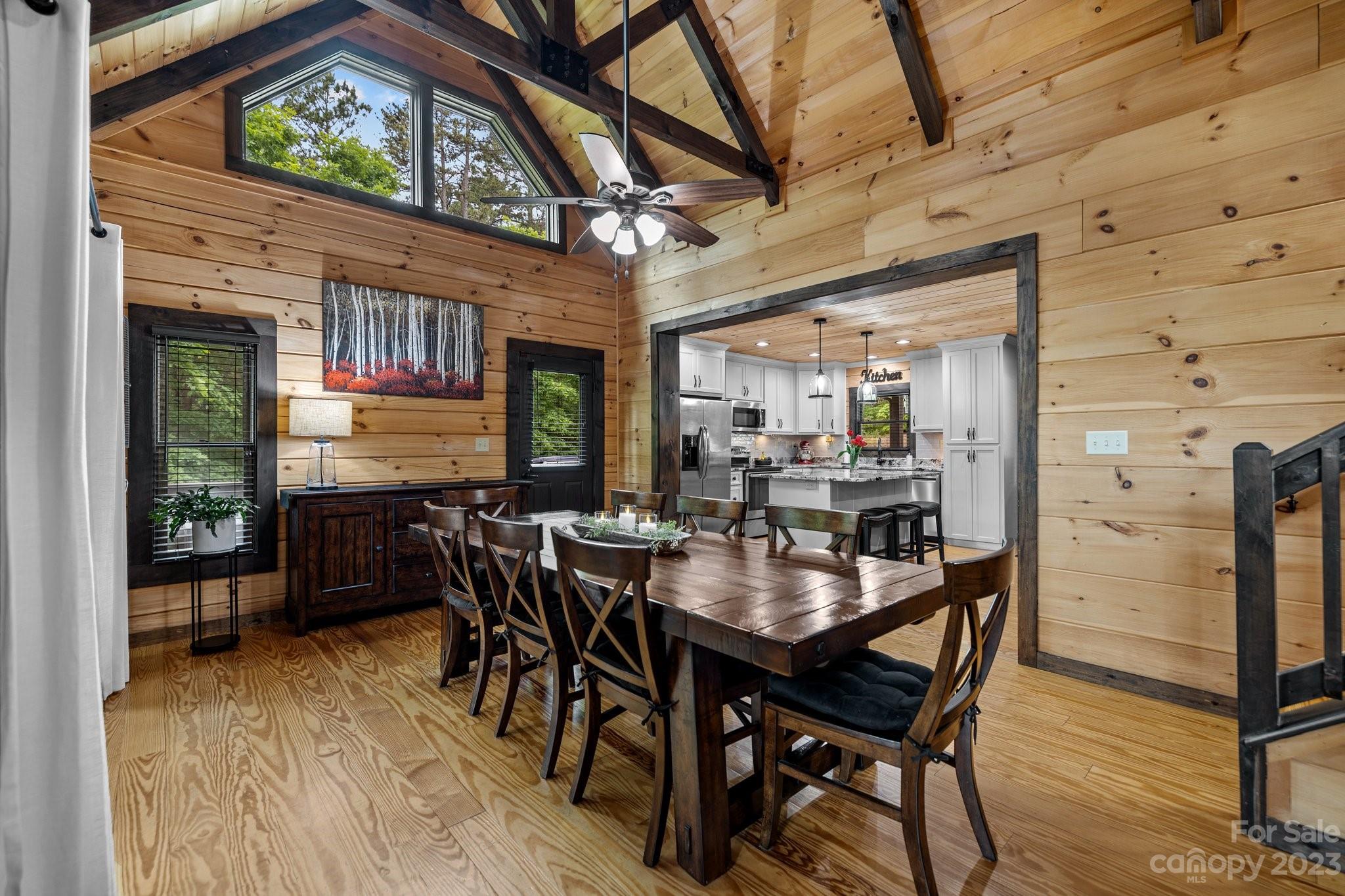 7478 Bankhead Road Denver, NC 28037 - Photo 12 of 48 a view of a dining room with furniture window and wooden floor