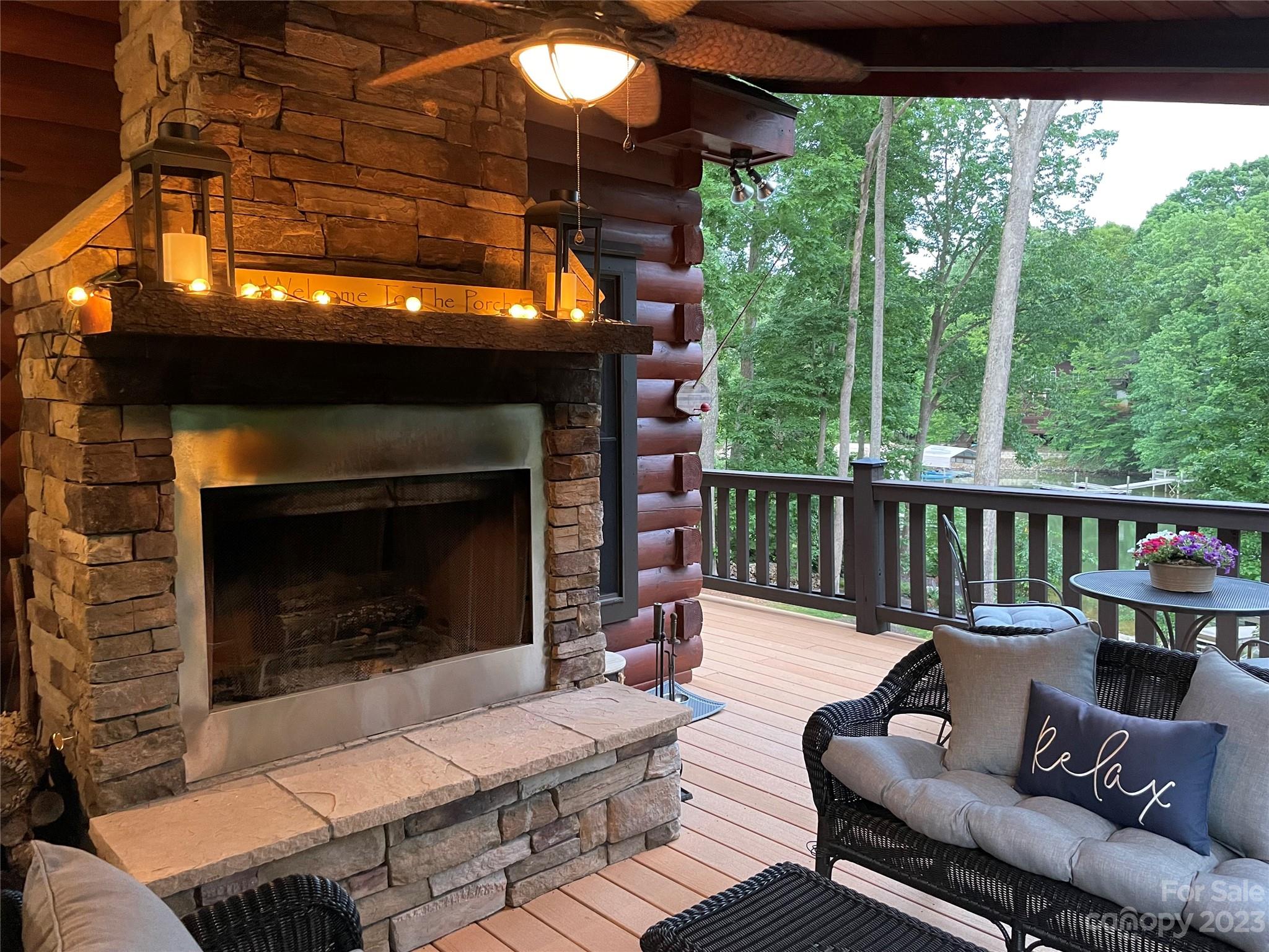 7478 Bankhead Road Denver, NC 28037 - Photo 16 of 48 a outdoor space with patio fireplace couches and a fireplace