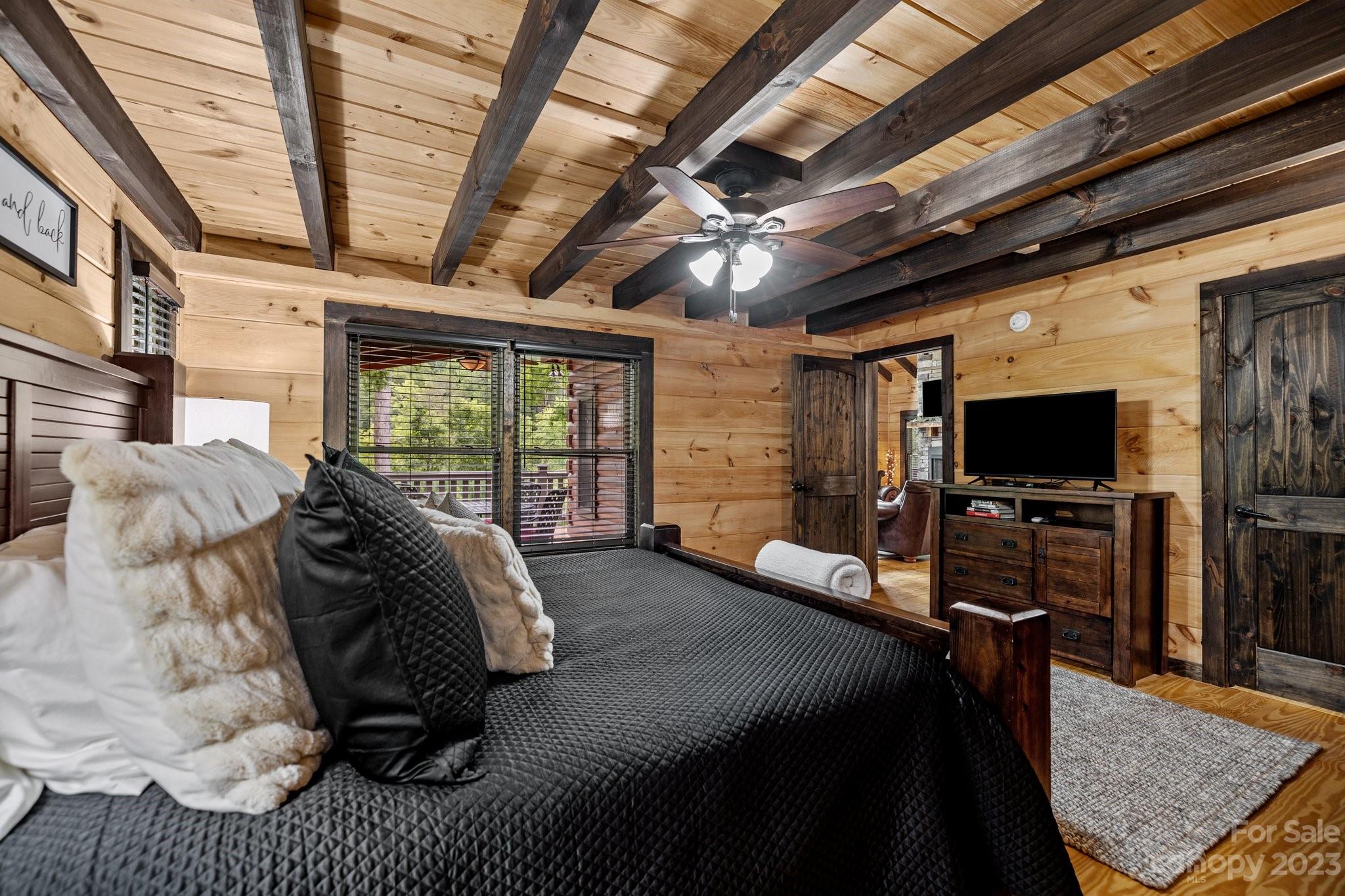 7478 Bankhead Road Denver, NC 28037 - Photo 20 of 48 a bed room with a bed and a television