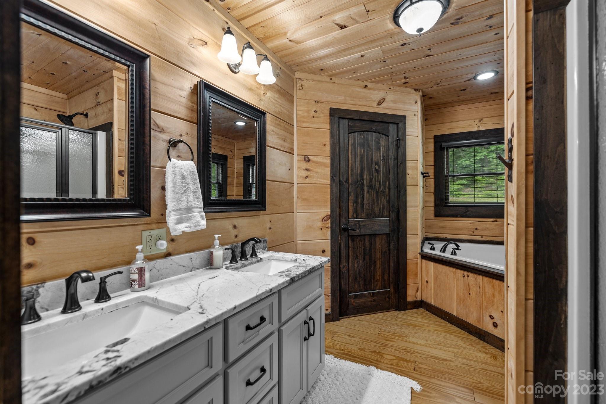 7478 Bankhead Road Denver, NC 28037 - Photo 21 of 48 a bathroom with a sink a vanity and a mirror