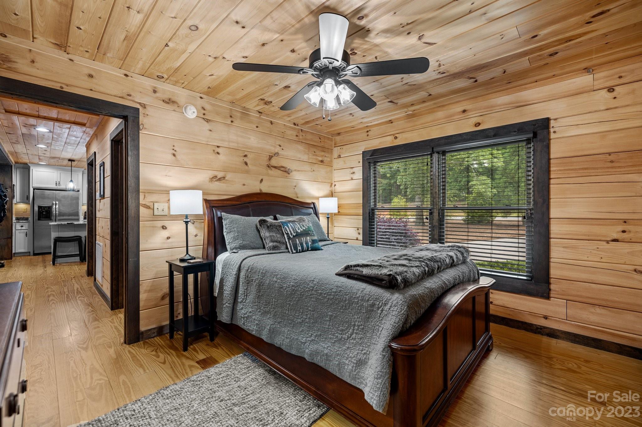 7478 Bankhead Road Denver, NC 28037 - Photo 24 of 48 a bedroom with a bed and wooden floor