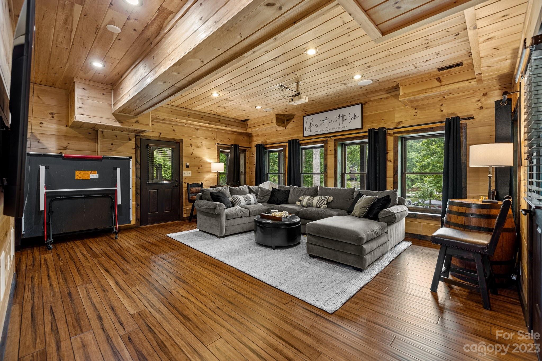7478 Bankhead Road Denver, NC 28037 - Photo 32 of 48 a living room with furniture and wooden floor