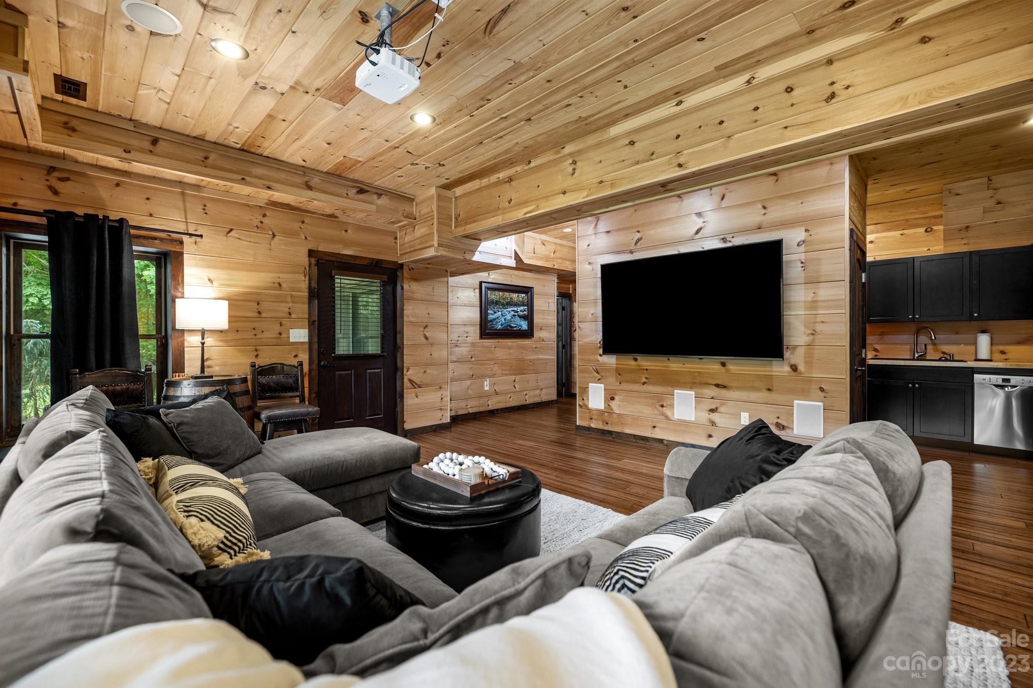 7478 Bankhead Road Denver, NC 28037 - Photo 33 of 48 a living room with furniture and a flat screen tv