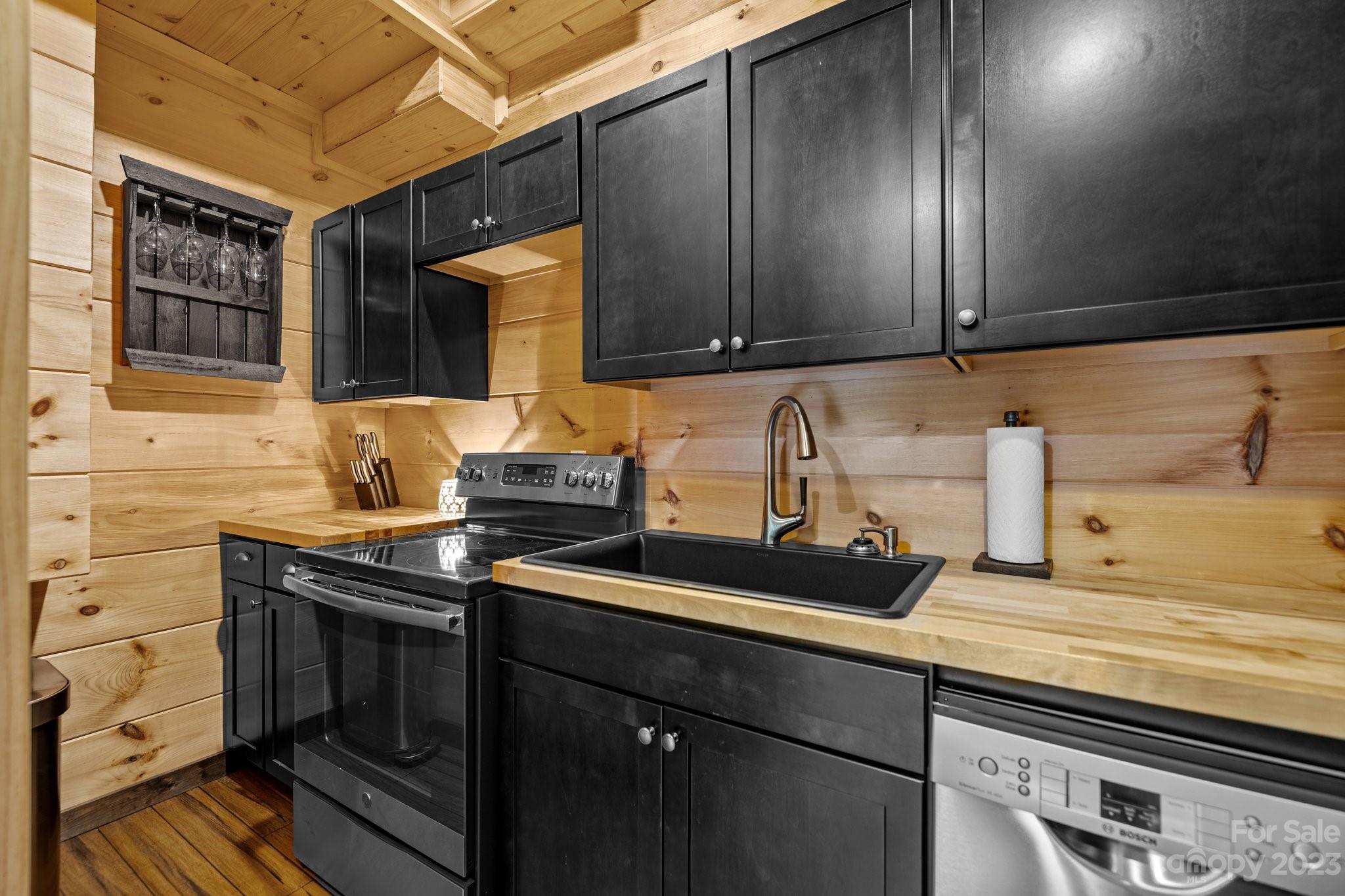 7478 Bankhead Road Denver, NC 28037 - Photo 36 of 48 a kitchen with a sink and cabinets