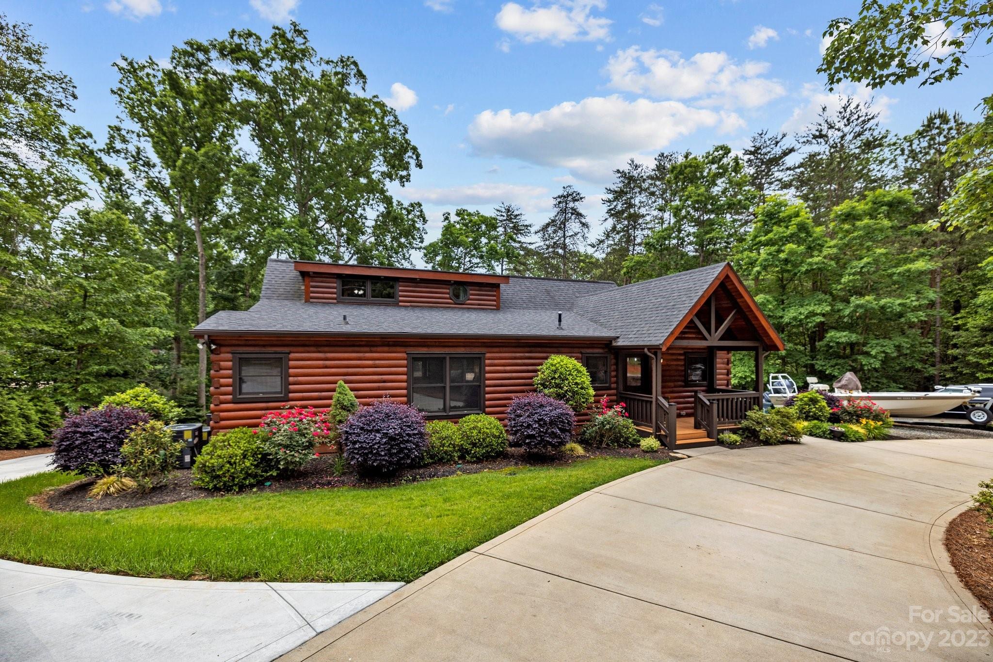 7478 Bankhead Road Denver, NC 28037 - Photo 5 of 48 a front view of a house with garden